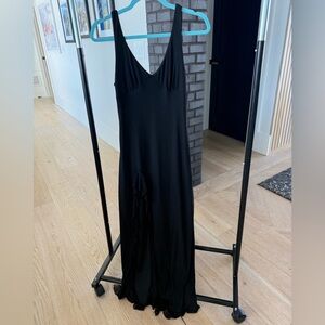 Simple long black stretch poly dress. Side zip. No brand on tag.